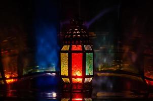 Lantern with light reflection from background for the Muslim feast of the holy month of Ramadan Kareem. photo