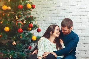 Horizontal picture of couple flirting with each other New Year's Eve photo