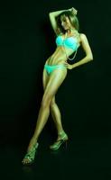 Full length portrit of pretty female in green tones photo