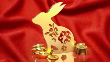 The gold rabbit and vintage Chinese money on red background  3d rendering photo