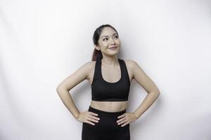 Shot of a sporty young confident woman posing against a white background. photo