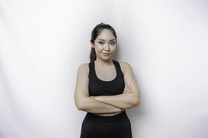 Shot of a sporty young confident woman posing against a white background. photo