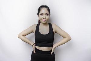 Shot of a sporty young confident woman posing against a white background. photo