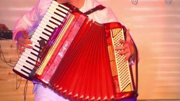 Close up of Manfrini accordion player, actor plays the accordion video