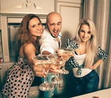 joyful people at a party with a martini photo