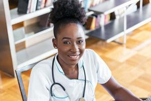 Doctor working in hospital writing a prescription, Healthcare and medical concept,test results in background, Stethoscope with clipboard and Laptop on desk. top view photo