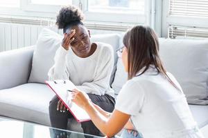 Patient receiving bad news, She is desperate and crying, Doctor support and comforting her patient with sympathy. Don't worry, this medical test is not so bad photo