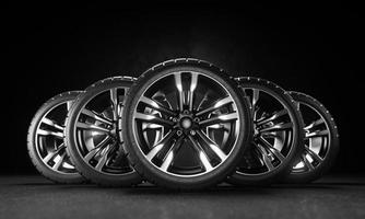 Five car wheels on asphalt and black background. Poster or cover design. 3D rendering illustration. photo