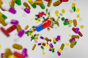 A lot of colorful medication and pills from above. 3D rendering illustration photo