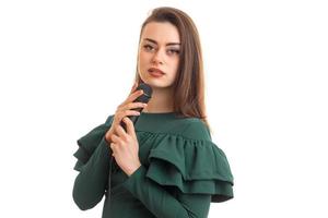 lovely young girl in green dress singing a karaoke photo