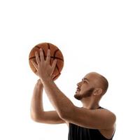 Basketball player shooting free throw on white background photo