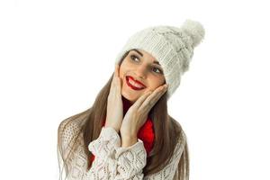 brunette girl in warm sweater and red scarf photo