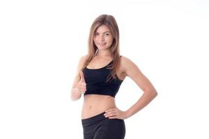Young slim athletic girl standing and smiling hand shows class photo
