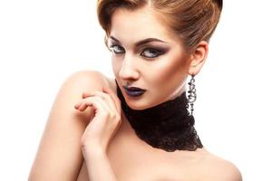 Horizontal portrait of fashion model with make up on white background photo