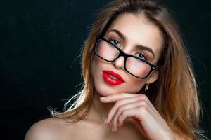portrait of woman with glasses and red lips photo