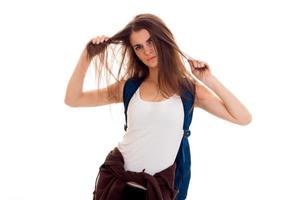 portrait of young angry student girl with blue backpack isolated on white background photo