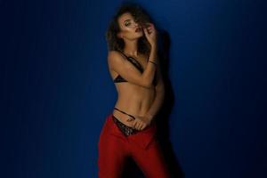 horizontal portrait of sexual girl in red pants and underwear photo