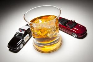 Police and Sports Car Next to Alcoholic Drink photo