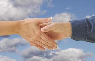 Man and woman shaking hands. photo