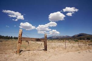 Aged Fence and Clouds photo