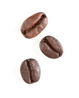Three Roasted Coffee Beans on White photo