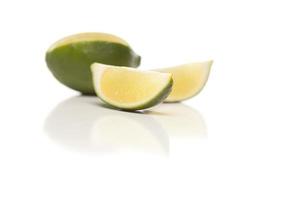 Sliced Lime on Reflective White Surface photo