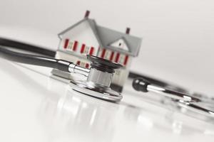 Stethoscope with Small Model Home photo