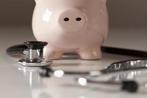 Piggy Bank and Stethoscope with Selective Focus photo