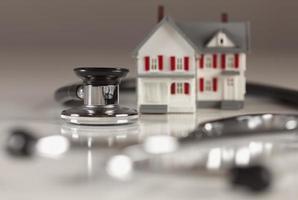 Stethoscope with Small Model Home photo