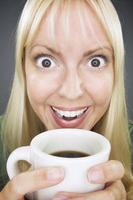 Beautiful Woman Enjoys Coffee photo