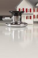 Stethoscope with Small Model Home photo