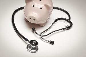 Piggy Bank and Stethoscope with Selective Focus photo