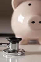 Piggy Bank and Stethoscope with Selective Focus photo