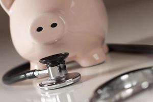 Piggy Bank and Stethoscope with Selective Focus photo