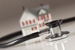 Stethoscope with Small Model Home photo