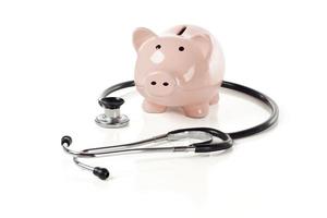 Piggy Bank and Stethoscope Isolated photo