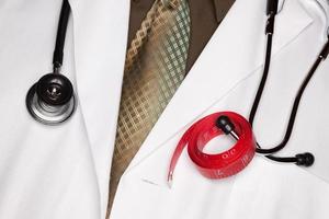Doctor with Stethoscope and Measuring Tape photo
