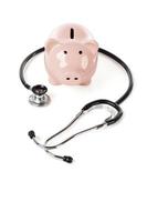 Piggy Bank and Stethoscope Isolated photo