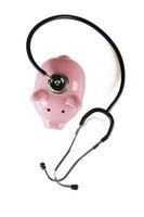 Piggy Bank and Stethoscope Overhead Isolated photo