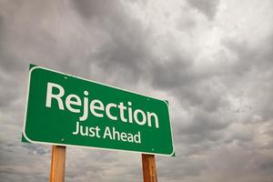 Rejection Green Road Sign Over Storm Clouds photo