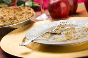 Apple Pie and Empty Plate with Remaining Crumbs photo