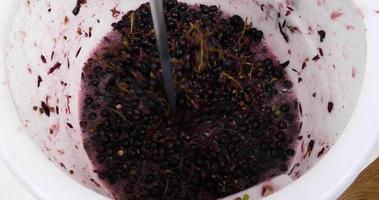 grinding fresh grapes for wine, wine making process video