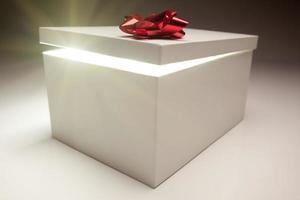 Red Bow Gift Box Lid Showing Very Bright Contents photo