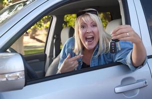 Attractive Woman In New Car with Keys photo