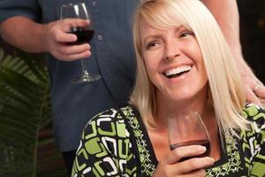 Blonde Socializing with Wine Glass photo