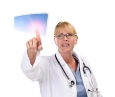 Female Doctor Touching Button on Touch Screen photo