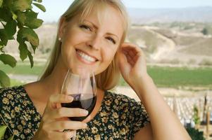 Attractive Woman Sips Wine photo