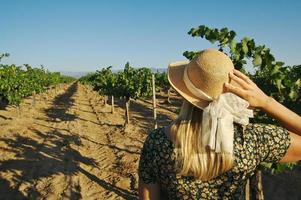 Beautiful Woman Strolling at a Winery photo