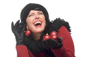 Attractive Woman Holding Red Ornaments photo