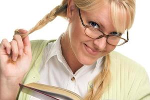 Female With Ponytails Reads Her Book photo